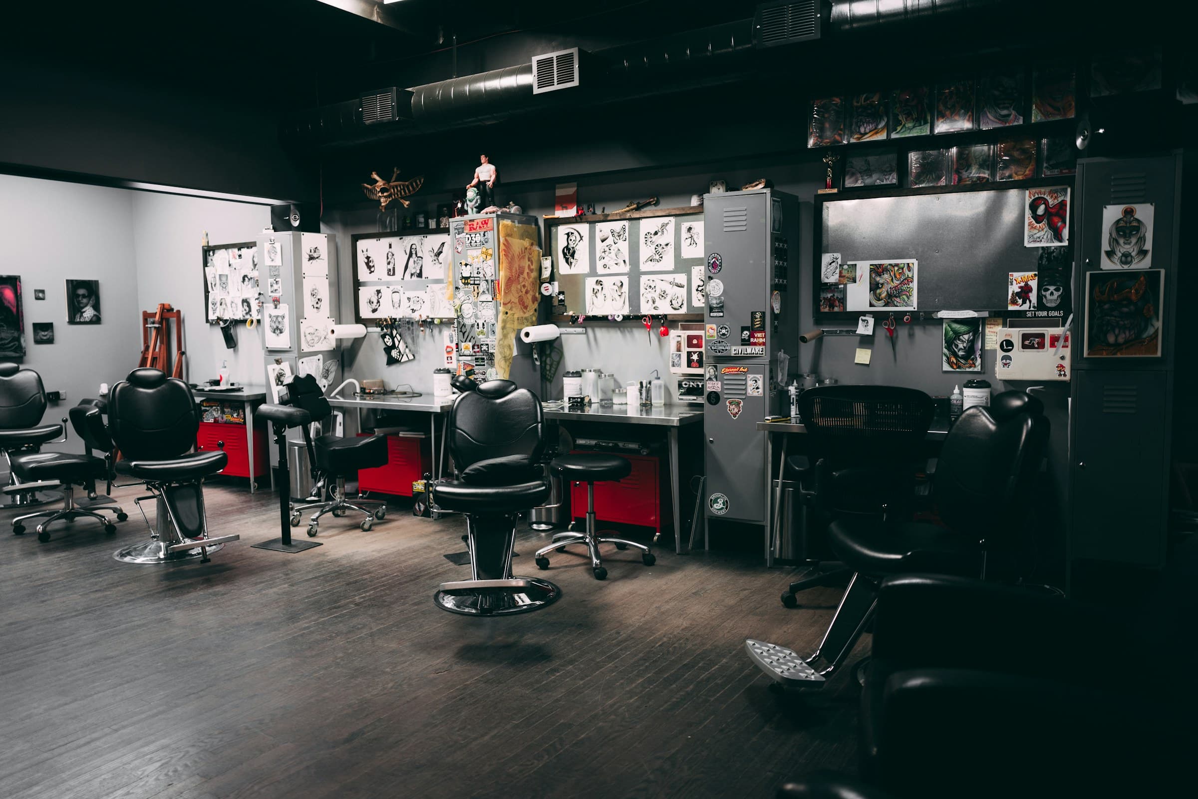 Empty tattoo chairs in a quiet studio